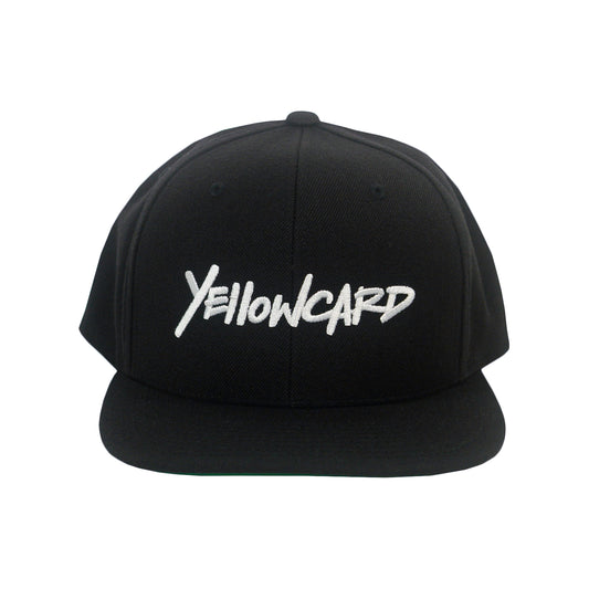 The Better Days Logo - Black Snapback features "Yellowcard" embroidered in white stylized cursive across the front.