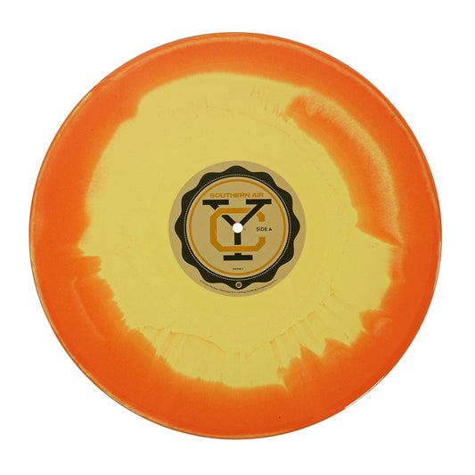 The Southern Air - Yellow & Orange Swirl - Vinyl LP features a vibrant tie-dye design resembling the sun's glow, with "Southern Air" on the center label.