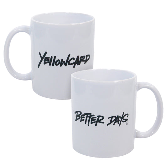 Two white ceramic mugs: one with "Yellowcard" in black script, the other with "Better Days" in black script. Both mugs, sold under the product name "Better Days - Mug," have handles on the right side.