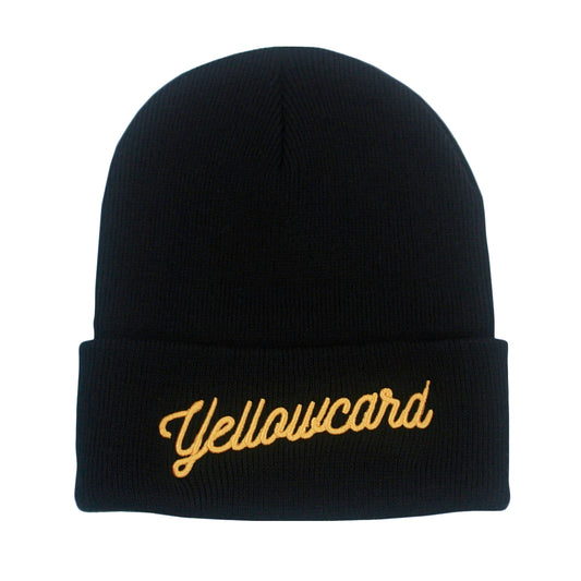 The Script Logo - Black Beanie is a black cuffed beanie with "Yellowcard" embroidered in yellow cursive on the front.